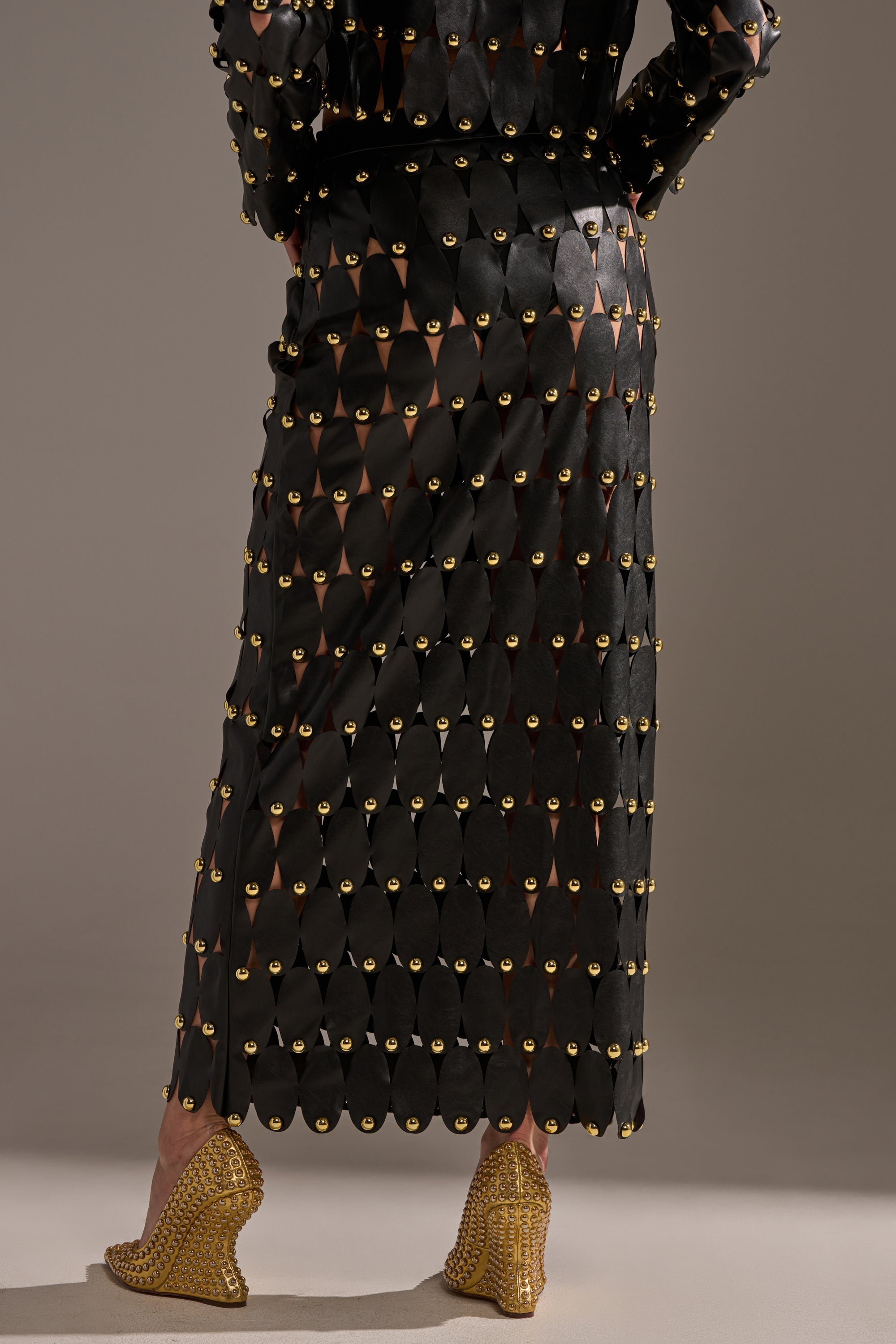 THE SNEAK PEEK STUDDED PU MIDI SKIRT IN BLACK