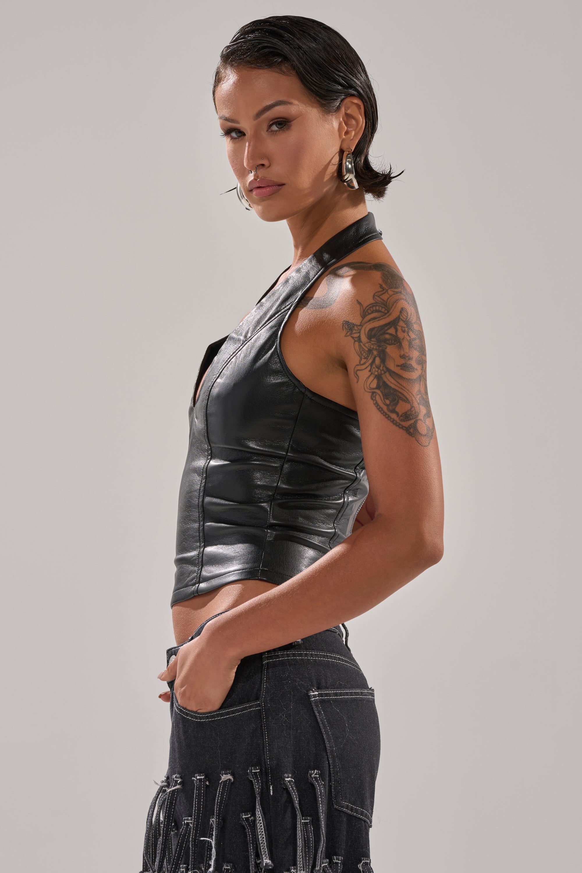 WITHOUT A DOUBT FAUX LEATHER HALTER NECK CORSET IN BLACK